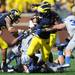 Michigan senior quarterback Denard Robinson looks to run past Air Force defense during the first quarter at Michigan Stadium on Saturday. Melanie Maxwell I AnnArbor.com